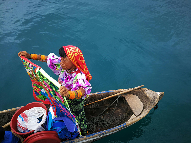 Panama Woman in Boat Showing Mola